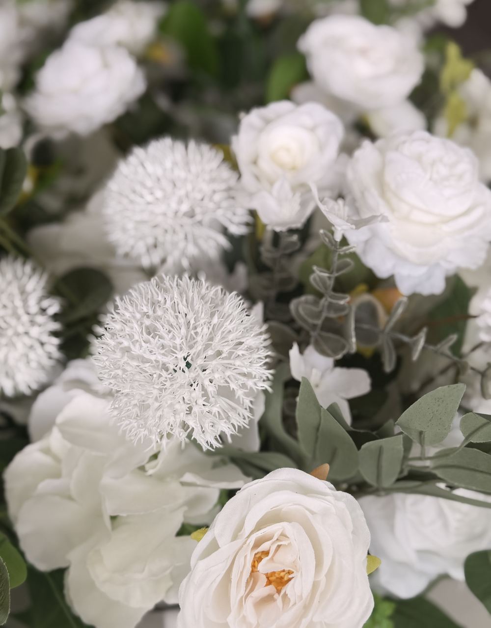 Ivory roses, white allium and sage eucalyptus, close up