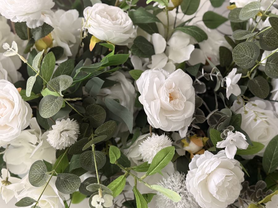 Ivory roses and eucalyptus, close up